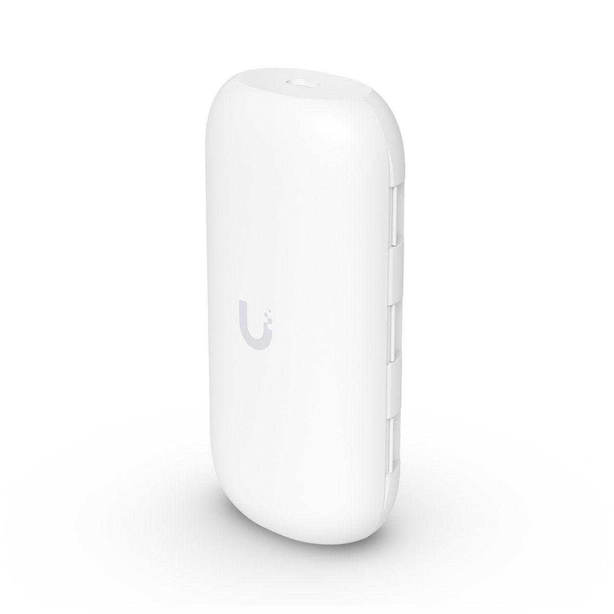 Un dispositivo elettronico bianco ed ellittico con un sottile logo U su una superficie bianca.