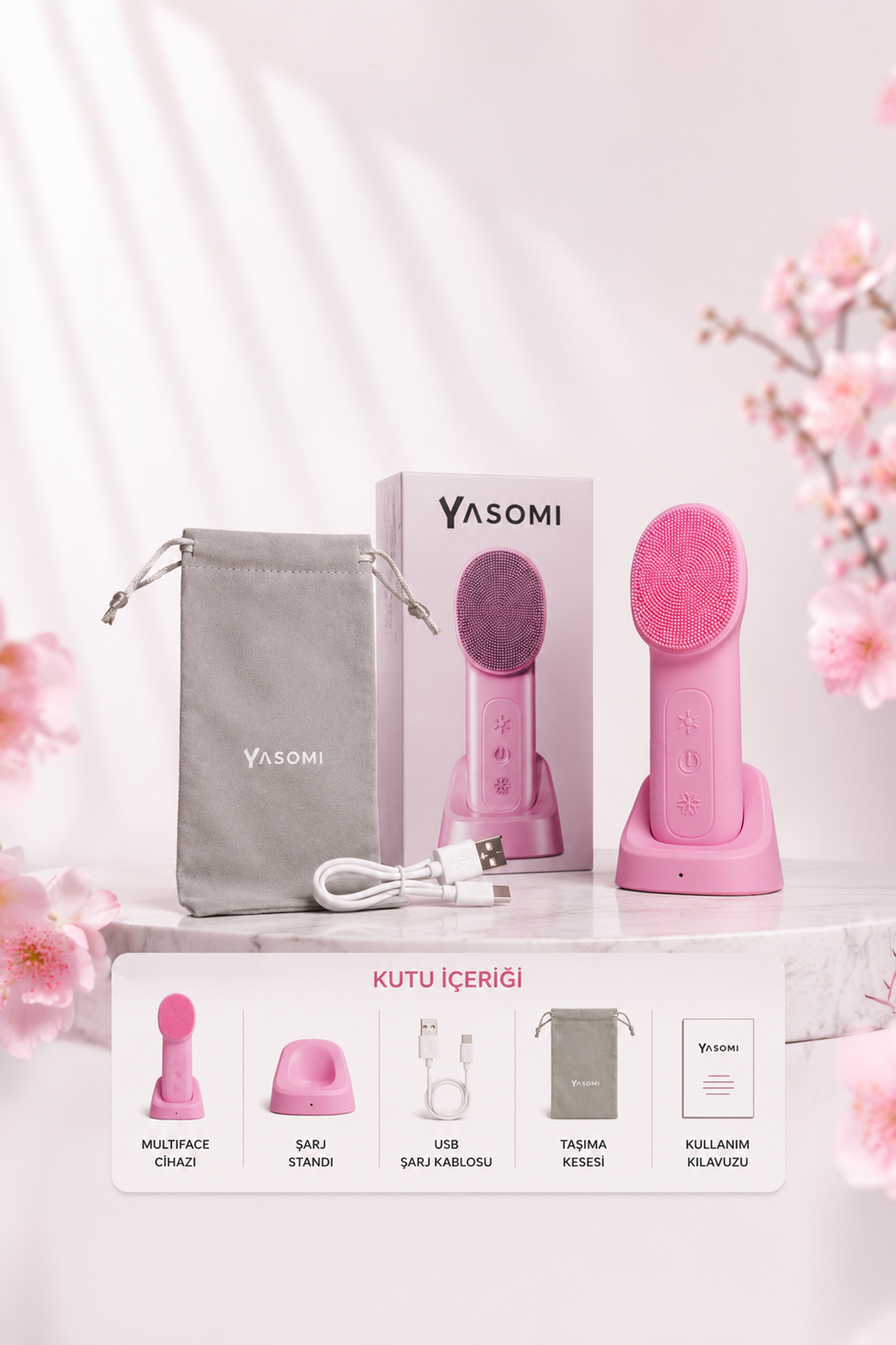 Şarj standı, USB kablosu, gri kese ve kutusuyla pembe yüz temizleme cihazı.