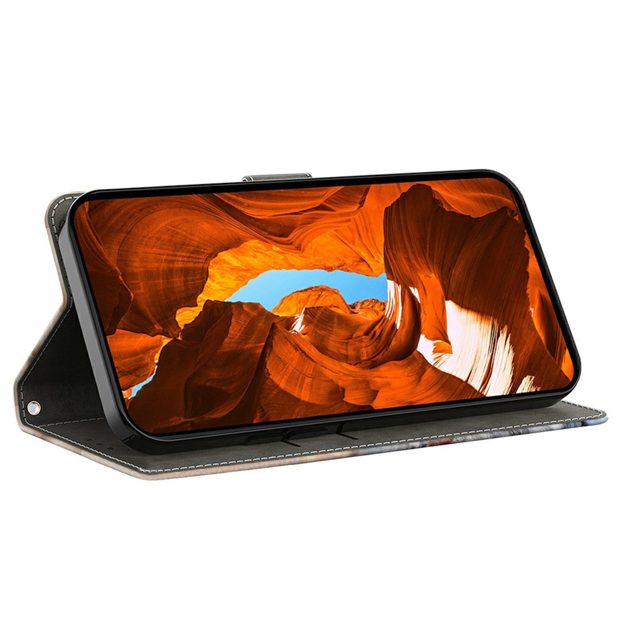 Ein Smartphone in einer Schutzhülle steht im Querformat auf einem Tisch mit einem Canyon-Hintergrundbild auf dem Display.