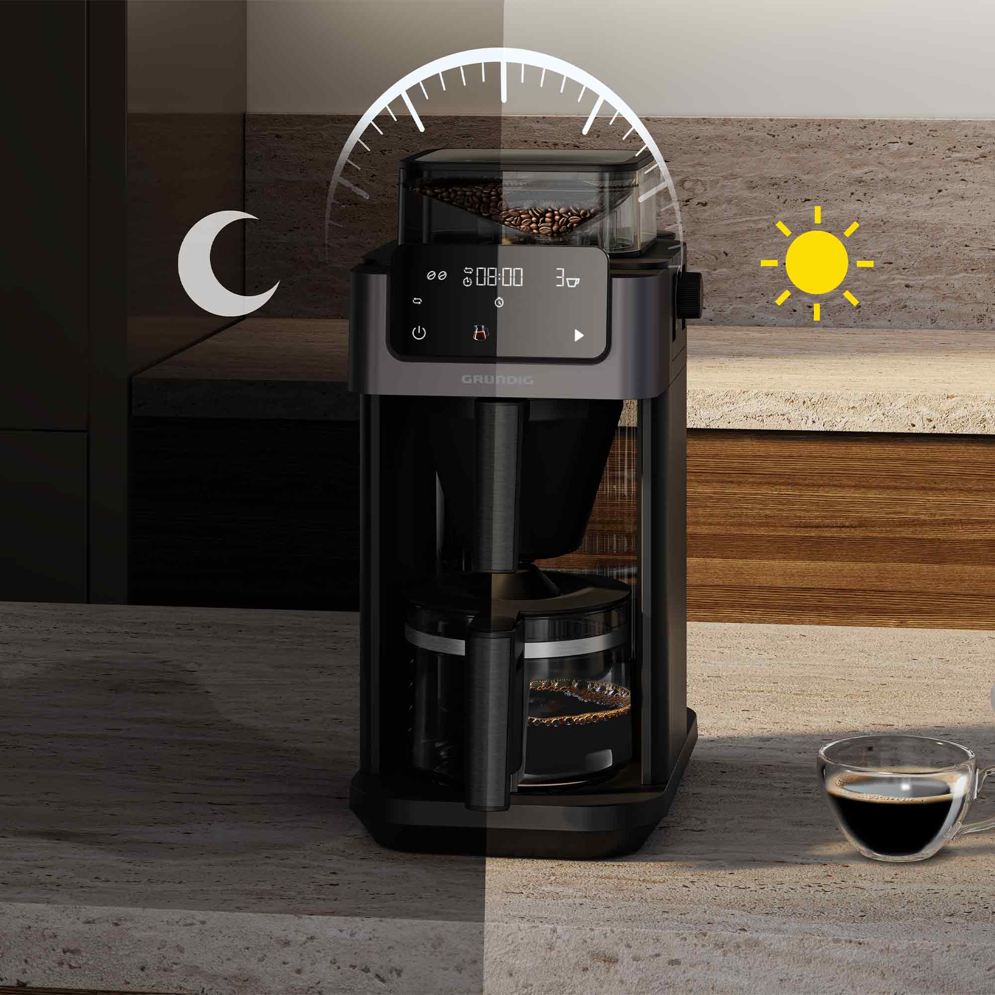 Moderne Kaffeemaschine auf einer Küchentheke mit Tag- und Nacht-Symbolen.