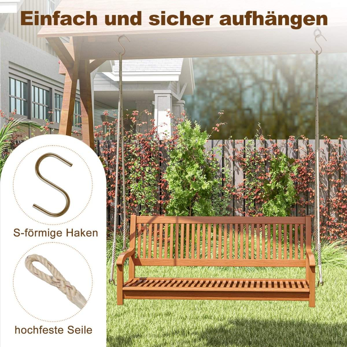 Houten tuinbank hangt aan touwen voor een schutting met struiken.
