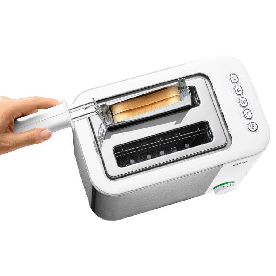 Un tostapane bianco con due fessure, un accessorio scaldapanini con pane e pulsanti circolari su sfondo bianco.