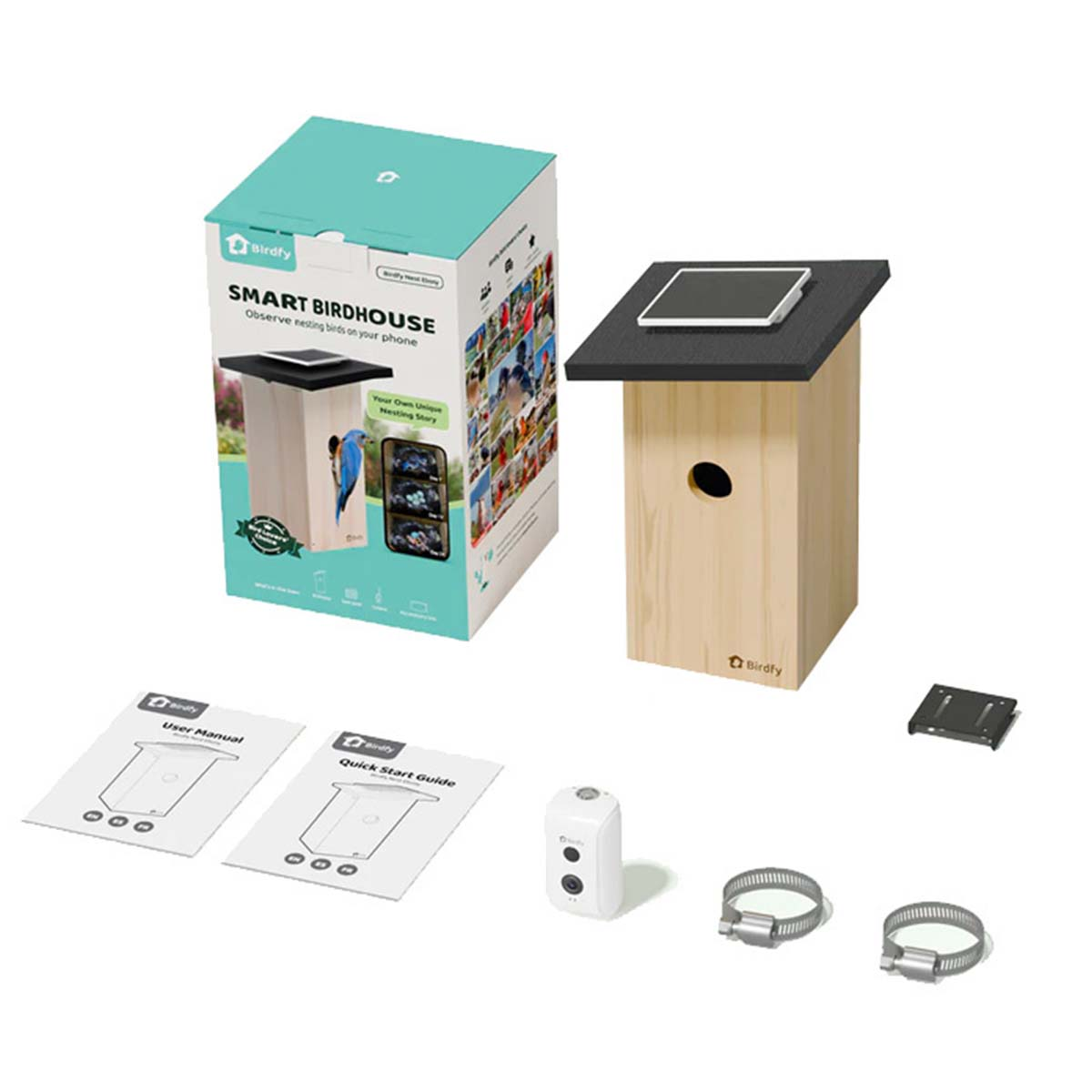 Intelligentes Vogelhaus mit Karton, Kamera, Handbüchern, Halterungen und Klemmen vor weißem Hintergrund.