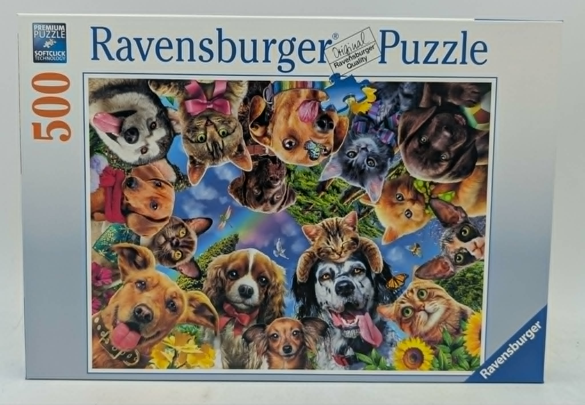 Ravensburger Puzzle-Schachtel mit vielen niedlichen Katzen- und Hundeköpfen.