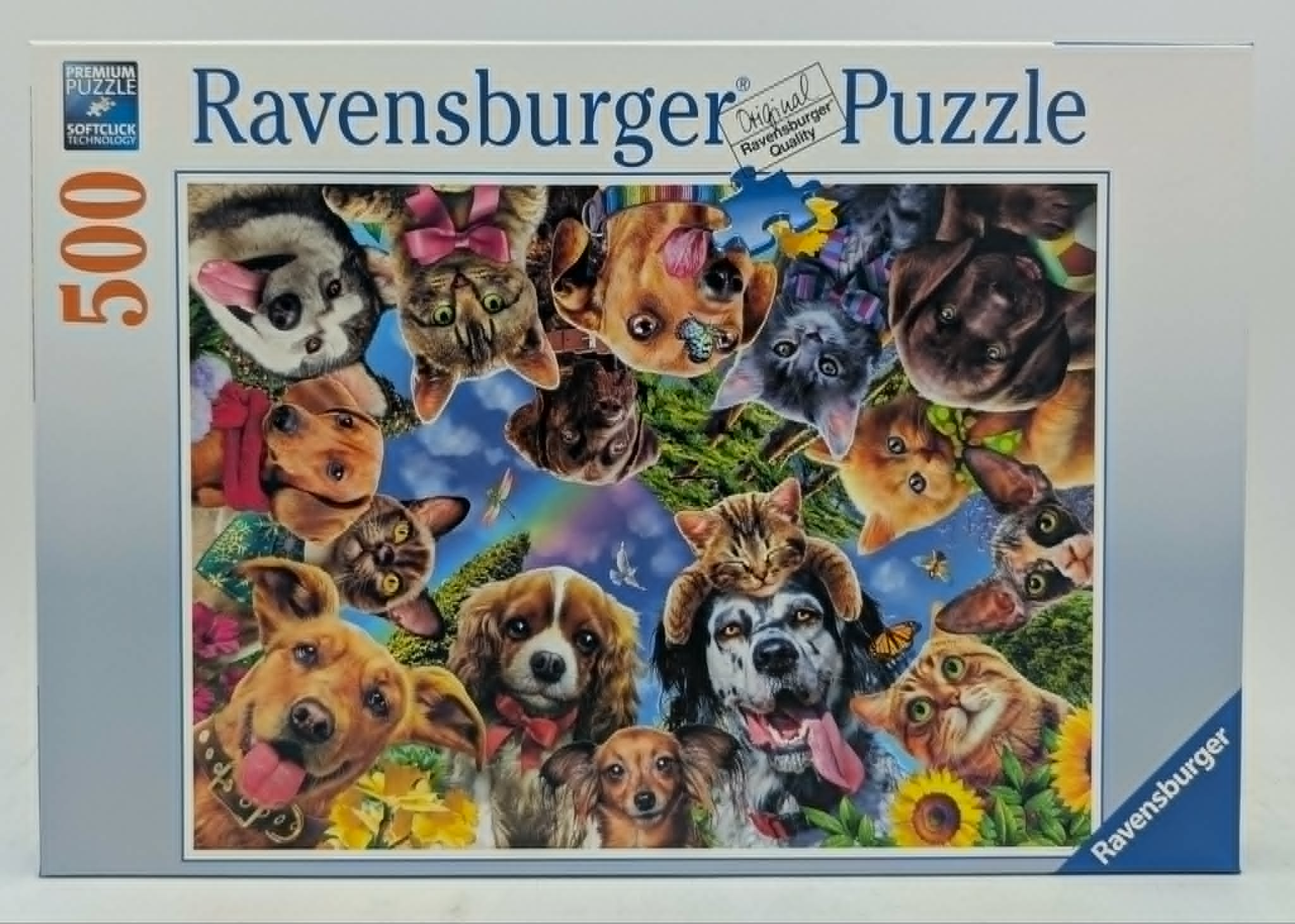 Ravensburger 500-Teile-Puzzlebox mit einer farbenfrohen Collage aus Porträts verschiedener Hunde und Katzen.