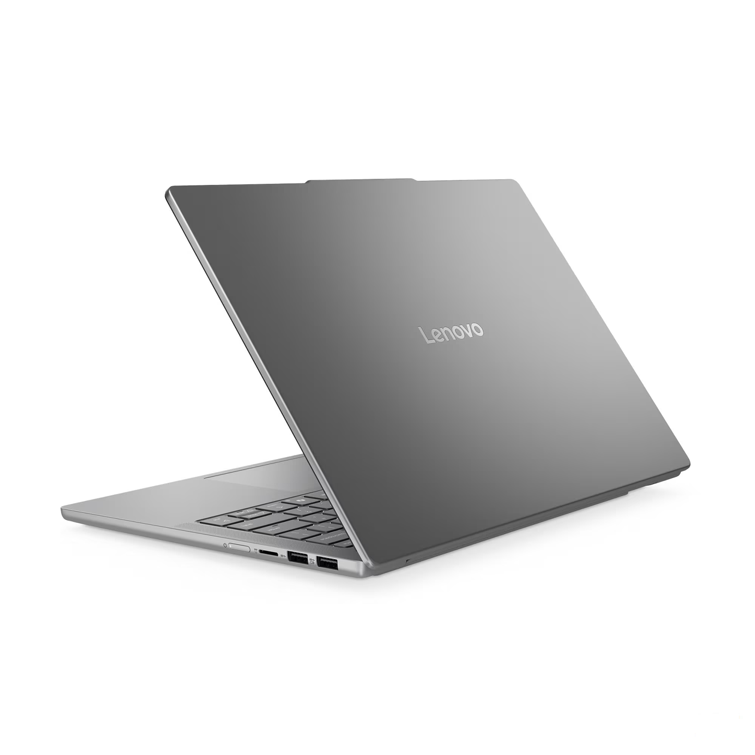 Gri renkli bir Lenovo dizüstü bilgisayar beyaz bir yüzeyde açık duruyor, logosu ve klavyesi görünüyor.