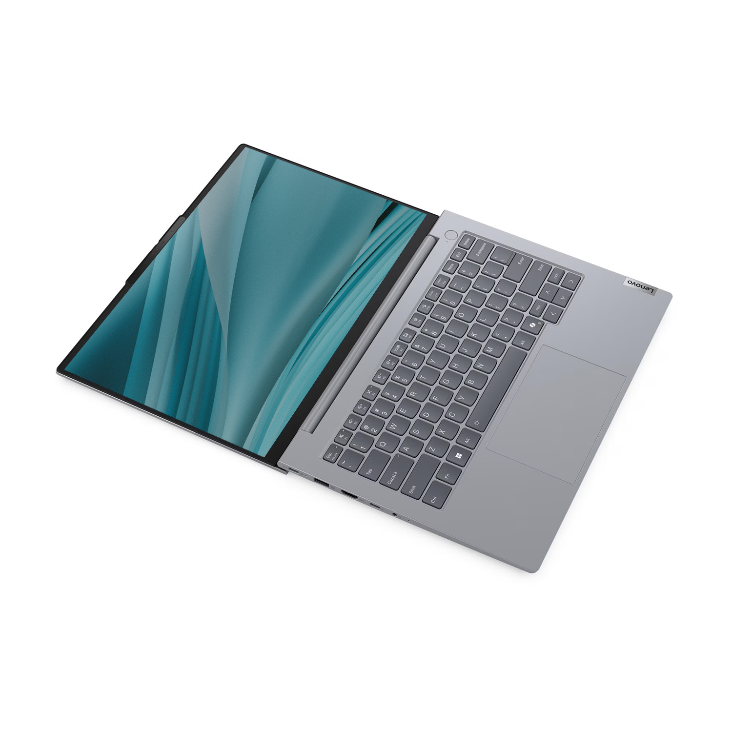 Gümüş rengi bir Lenovo dizüstü bilgisayar beyaz arka planda açık duruyor, turkuaz bir ekran gösteriyor.