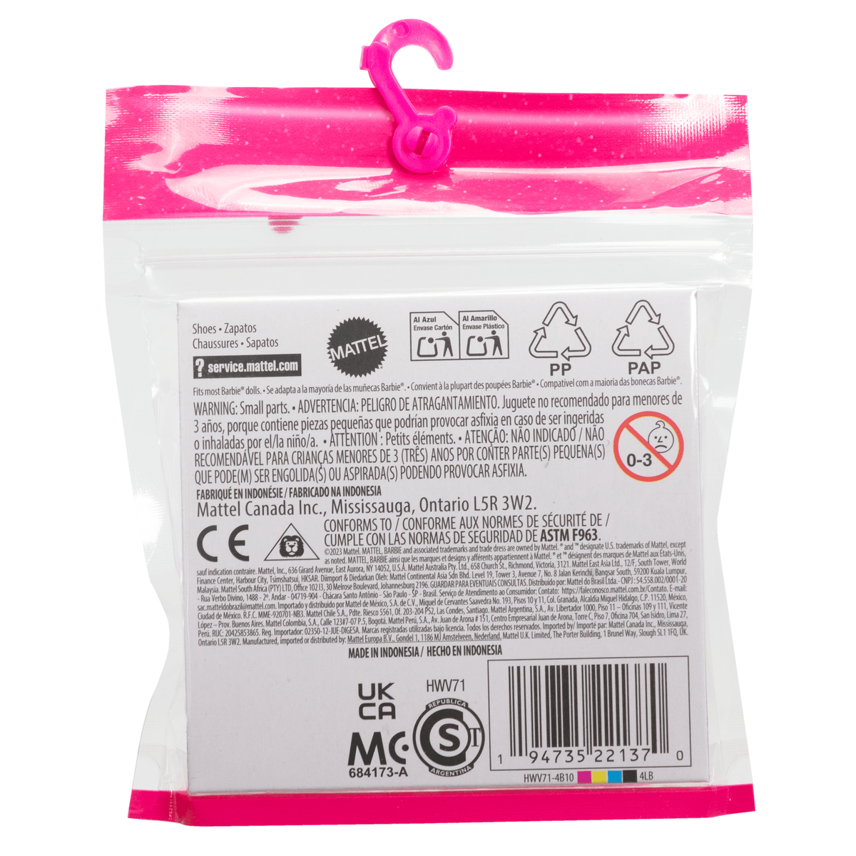 Parte posterior de un empaque de juguete rosa con advertencias y código de barras.
