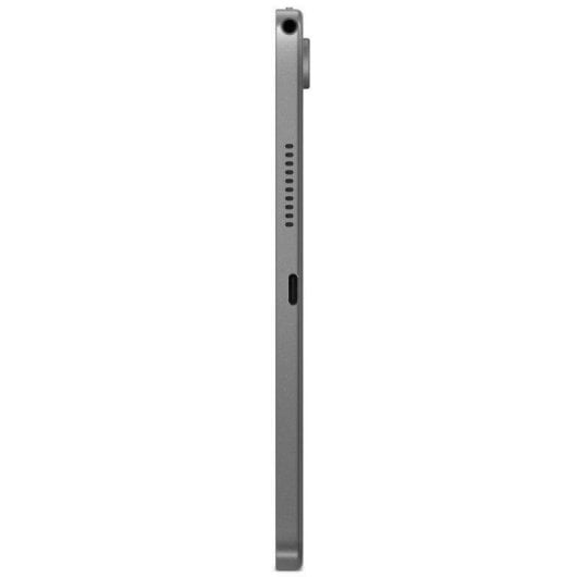 Vista laterale di un tablet grigio che mostra altoparlanti, porte e un microfono su sfondo bianco.