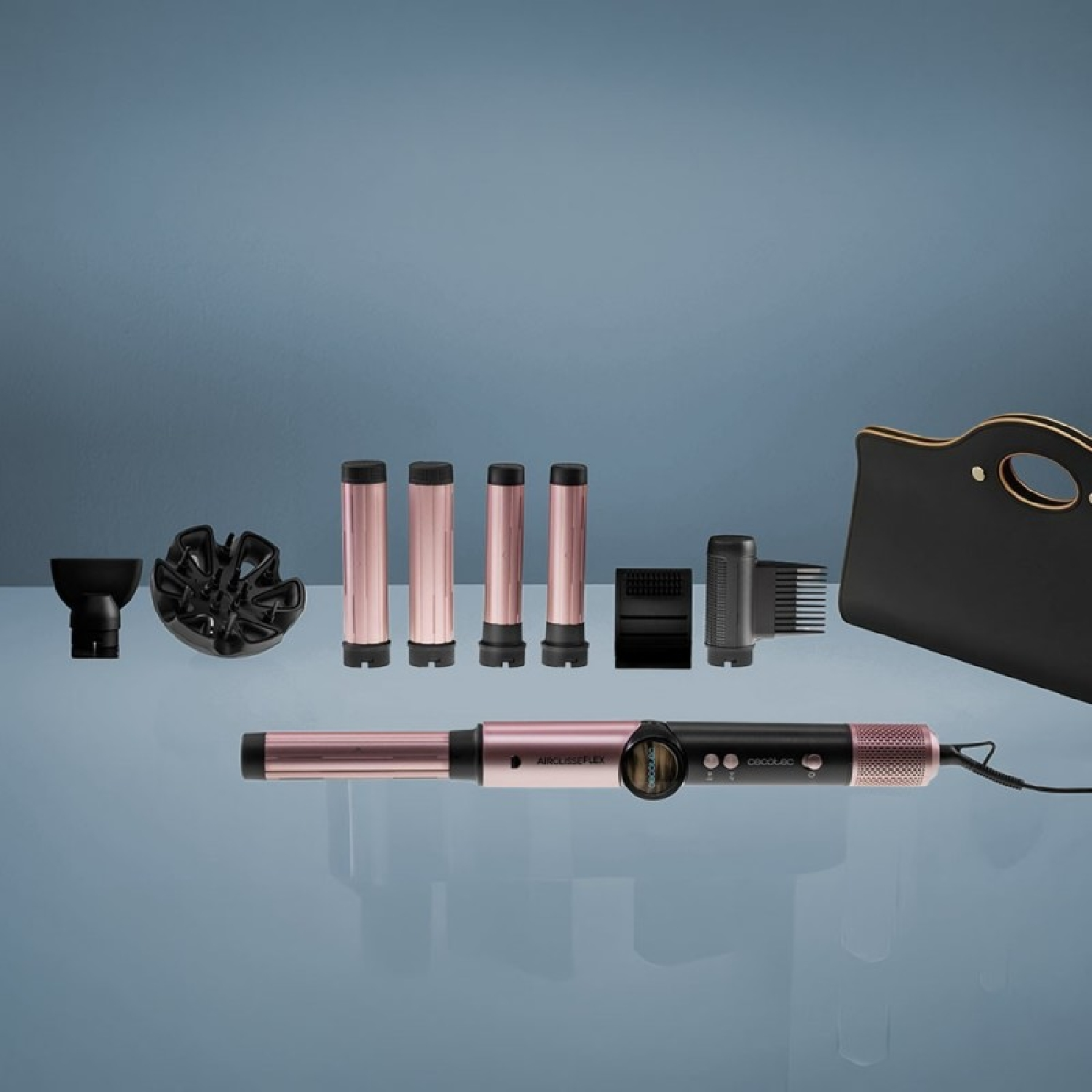 Styling per capelli rosa e nero con accessori, diffusore e borsa nera su sfondo blu.
