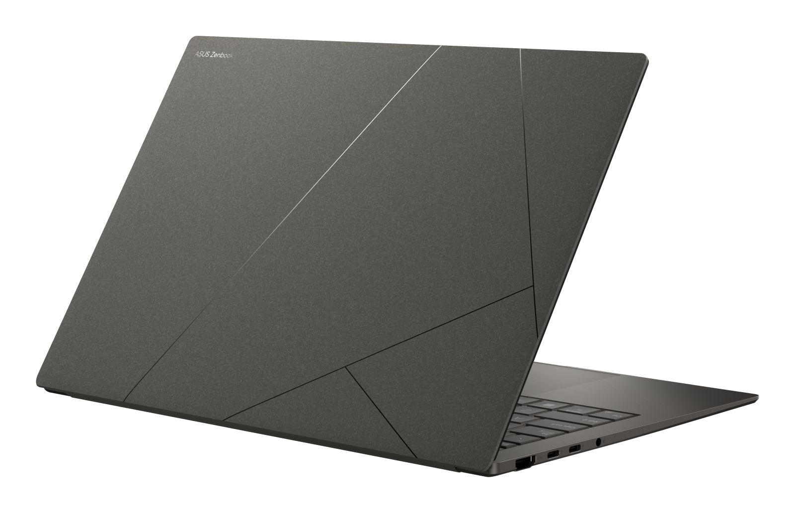 Ein grauer ASUS ZenBook Laptop mit geschlossenem, gemustertem Deckel auf weißem Hintergrund.