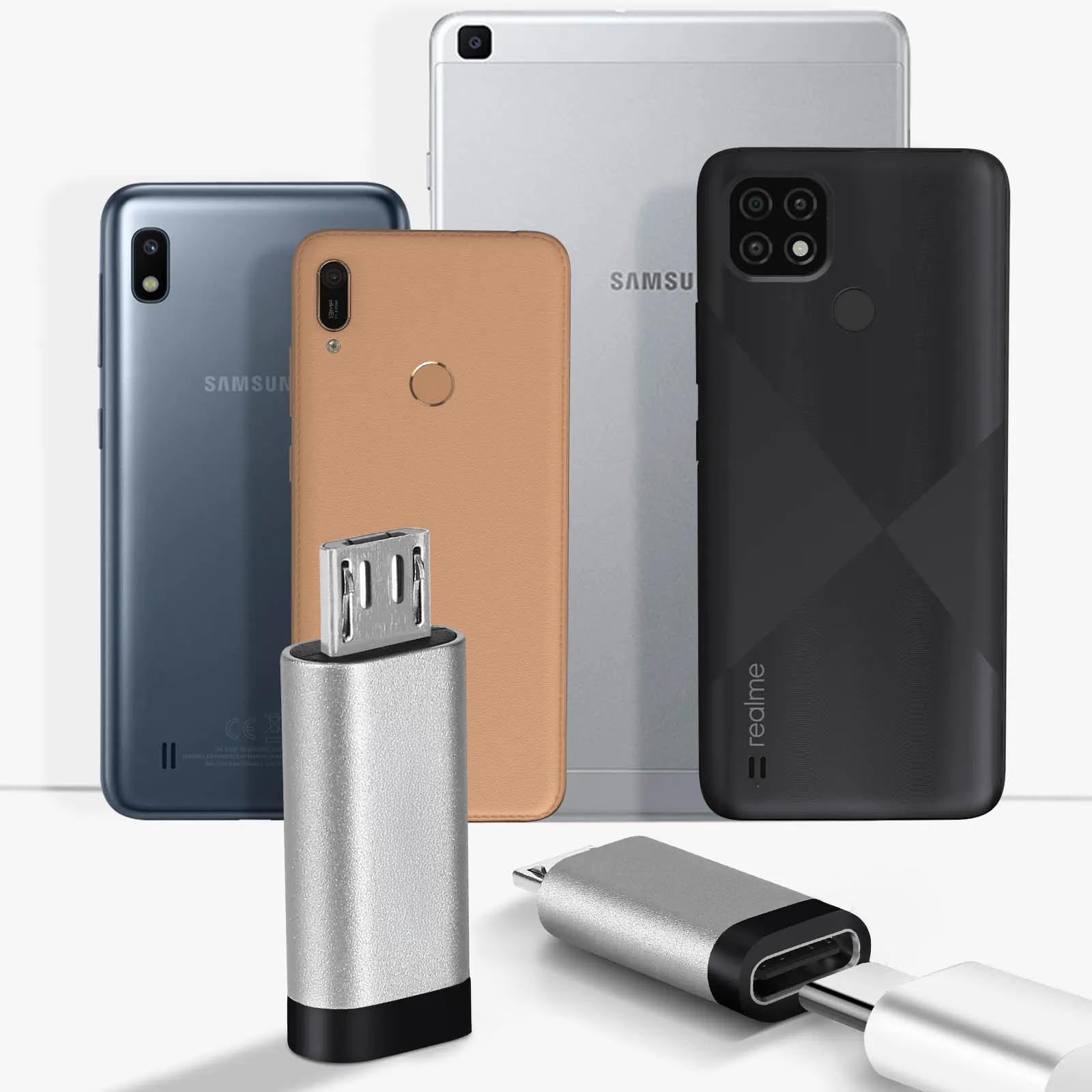 Verschiedene Smartphones und ein silberner OTG-Adapter mit USB-Anschluss auf weißem Hintergrund.