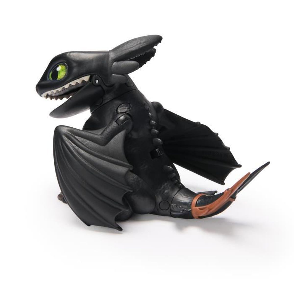 Ein schwarzes Ohnezahn-Drachenspielzeug mit grünen Augen und brauner Schwanzflosse auf weißem Grund.