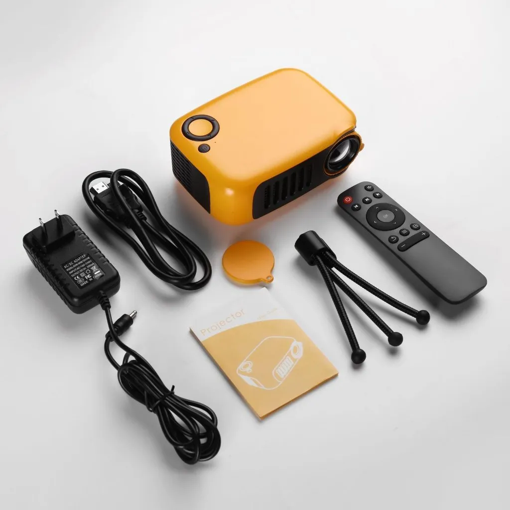 Gelber Mini-Projektor mit Netzteil, HDMI-Kabel, Fernbedienung, Mini-Stativ und Anleitung.