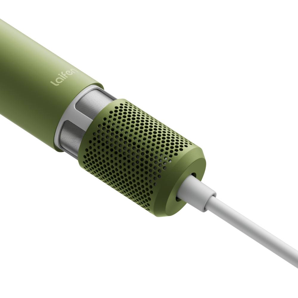 Grüner Laifen Haartrockner mit perforiertem Filter und weißem Kabel auf weißem Hintergrund.