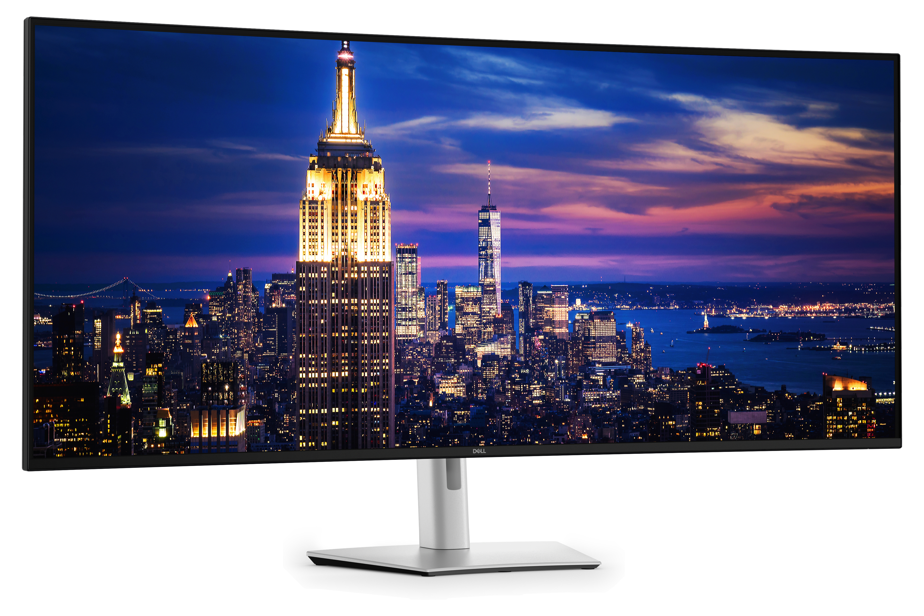 Ein breiter, gebogener Dell-Monitor zeigt eine nächtliche Skyline von New York City.