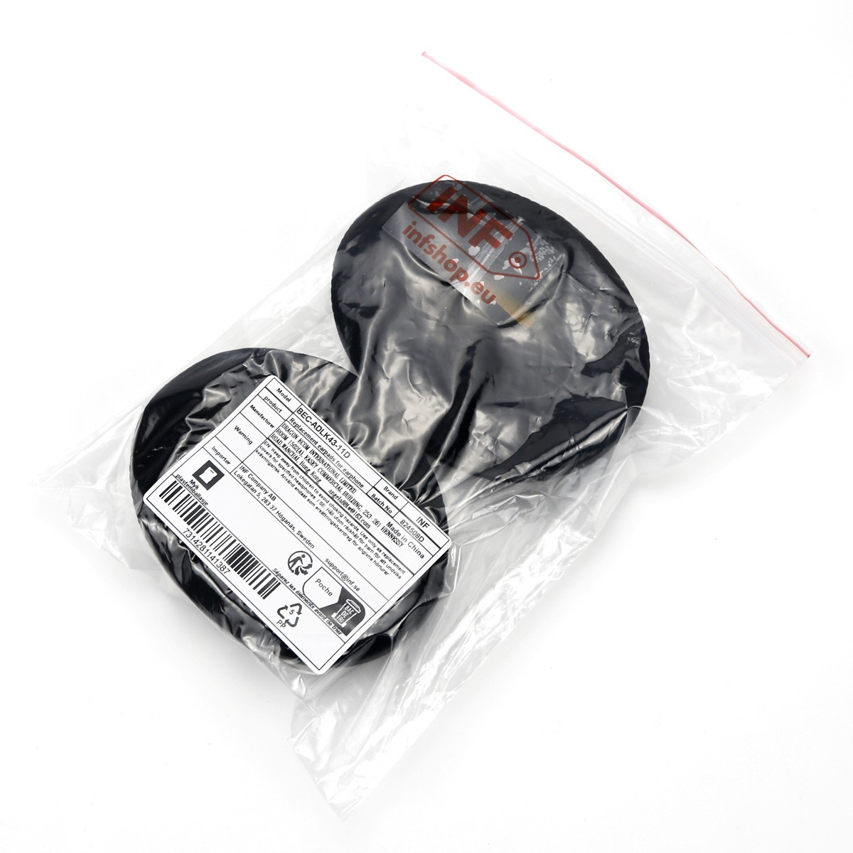 Due cuscinetti auricolari neri in un sacchetto di plastica sigillato con etichetta.