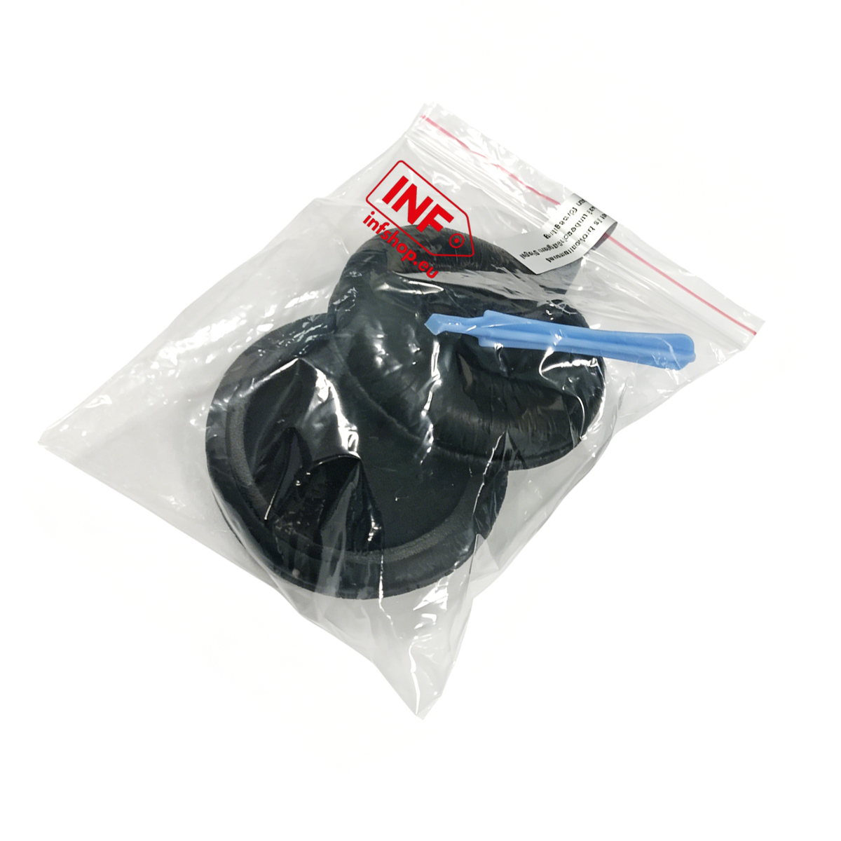 Cuscinetti auricolari neri e un utensile blu in un sacchetto.