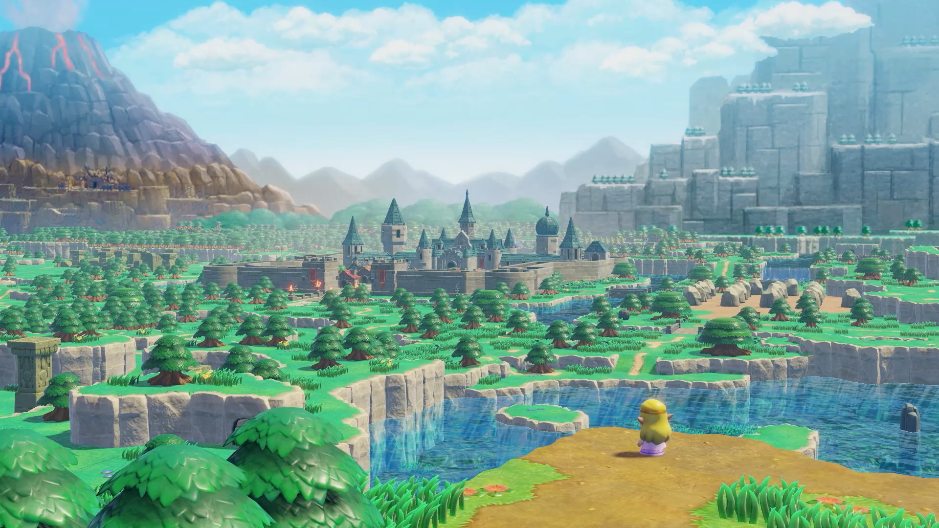 Prinzessin Zelda steht auf einer Klippe und blickt auf eine grüne Landschaft mit Schloss, Flüssen und Bergen im Hintergrund.
