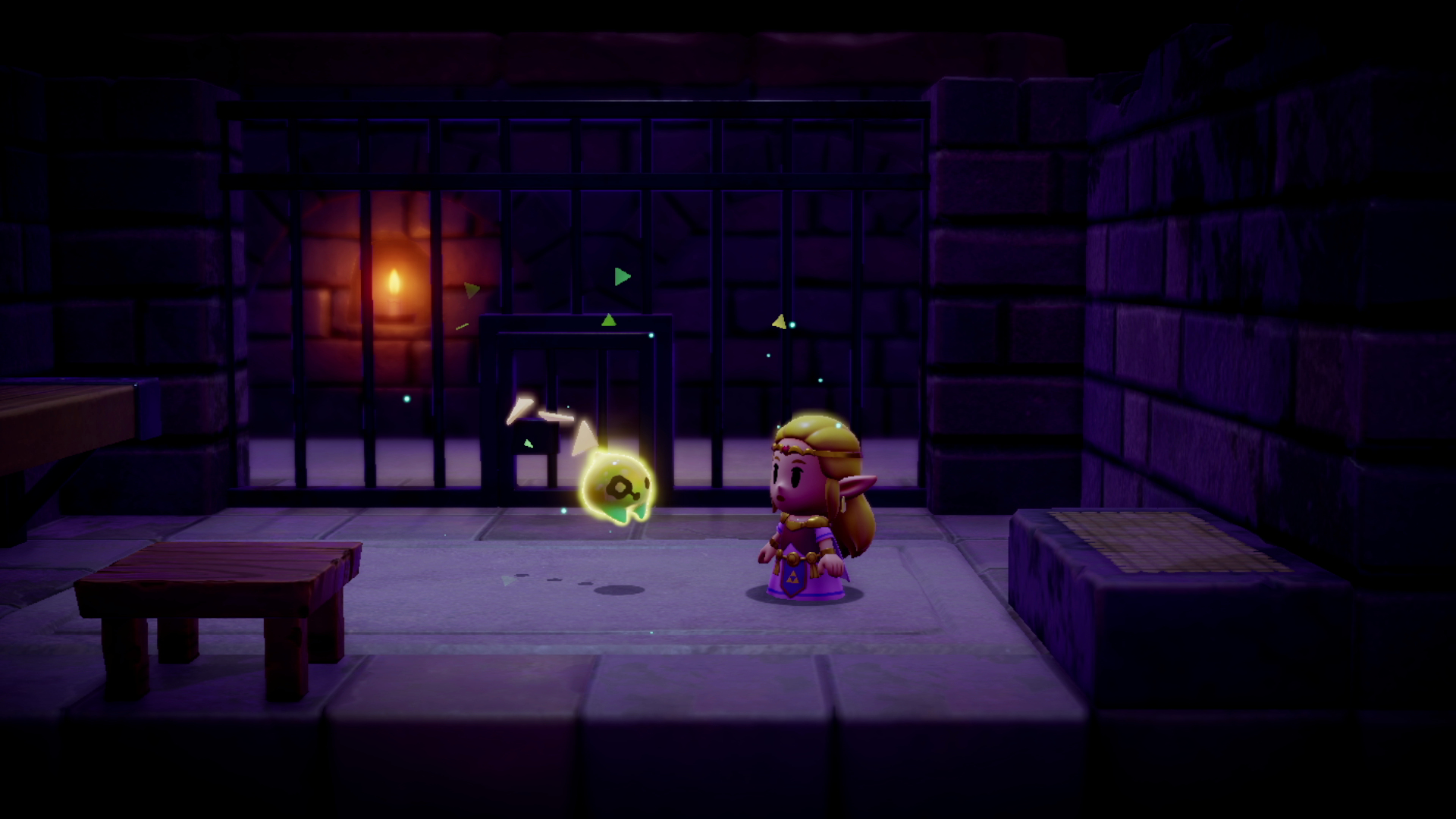 Prinzessin Zelda steht in einem dunklen Kerker vor einer leuchtenden Kreatur.