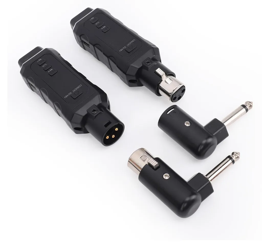Zwei schwarze drahtlose Audio-Adapter mit XLR- und 6,35-mm-Klinkensteckern auf weißem Hintergrund.
