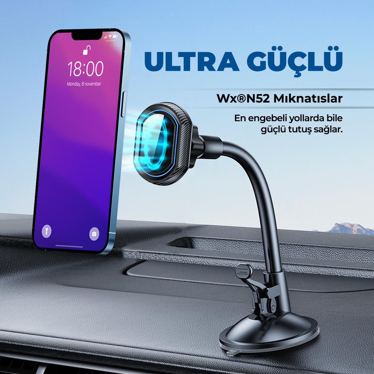 Bir araç torpidosunda manyetik telefon tutucusuna takılı akıllı telefon.