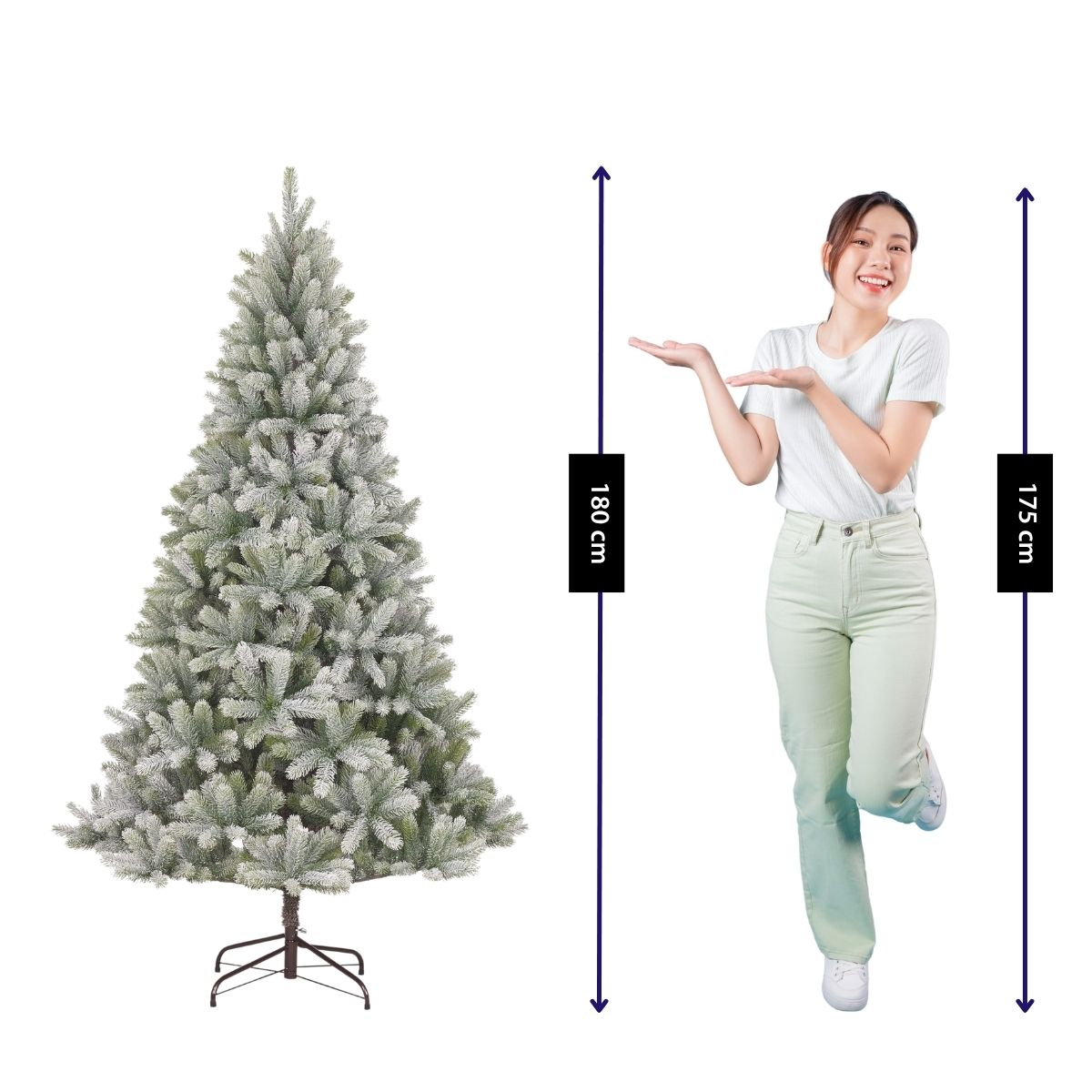 A woman stands beside a snowy 180 cm artificial Christmas tree with height measurement indicators.