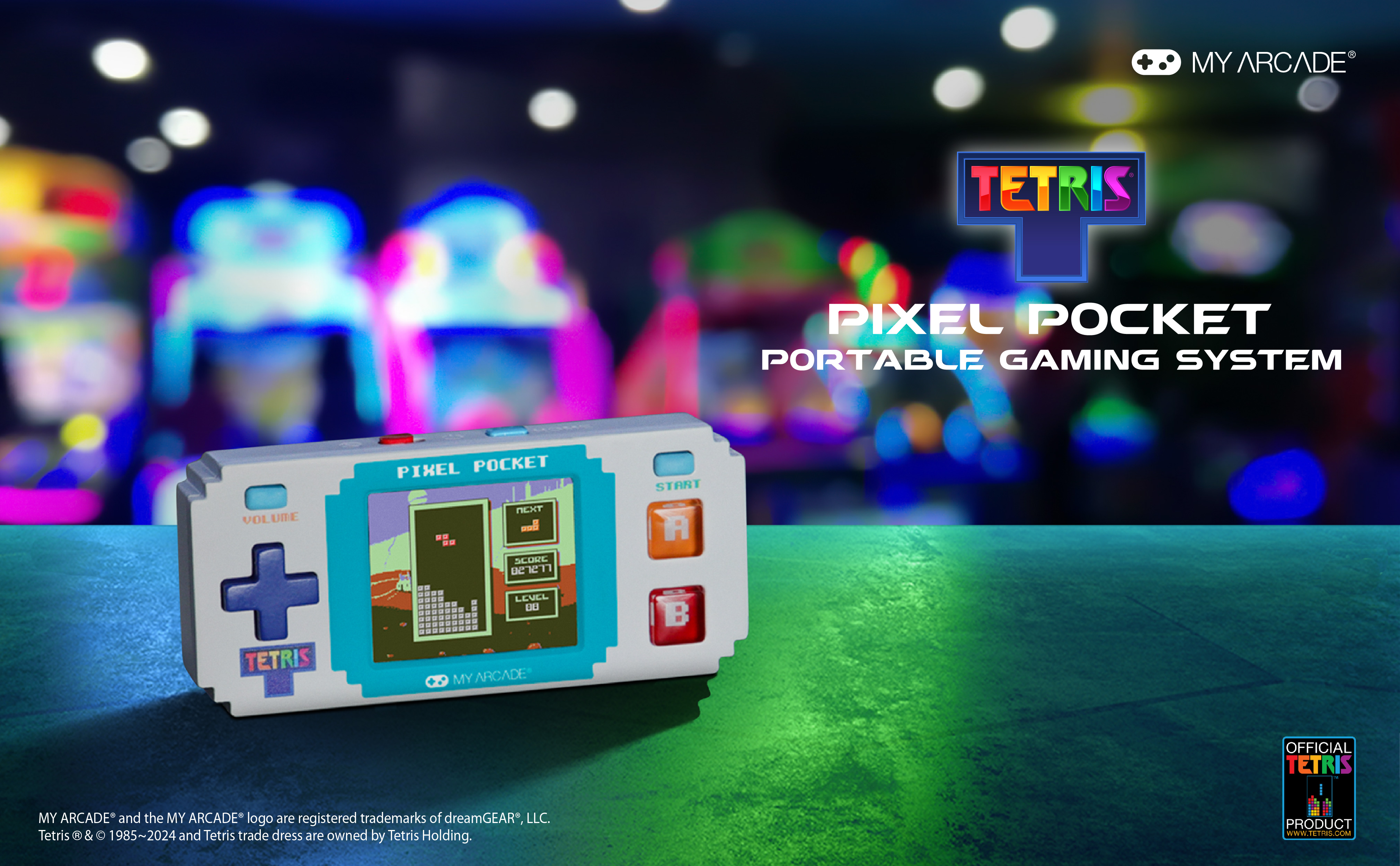 My Arcade Tetris Pixel Pocket tragbare Spielkonsole auf grünem Tisch mit verschwommenem Hintergrund.