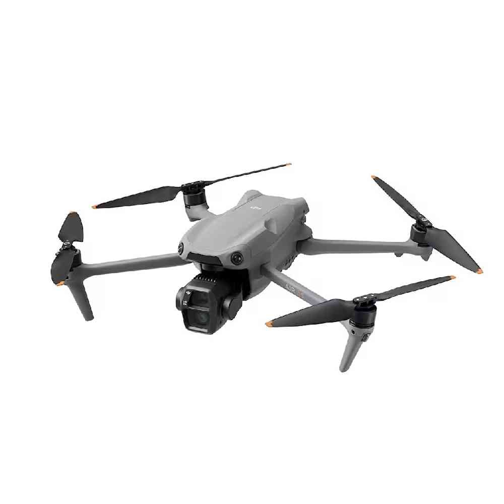 Beyaz arka planda dört pervaneli ve ön kameralı gri bir drone.