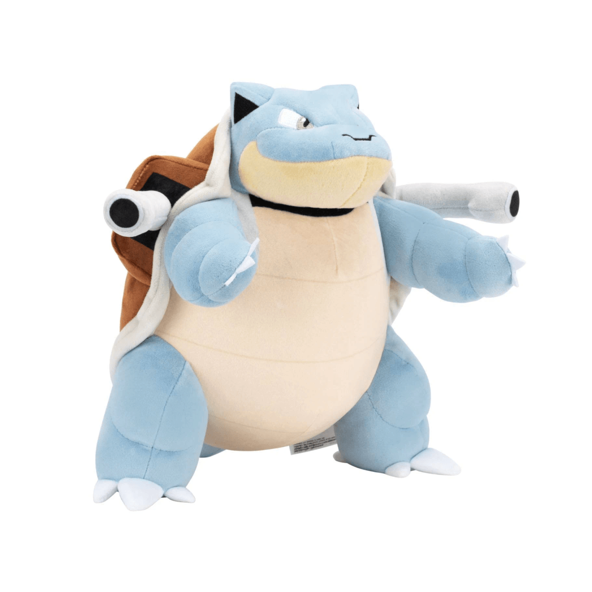 Une peluche de Tortank avec un corps bleu, une carapace marron et deux grands canons sur son dos.