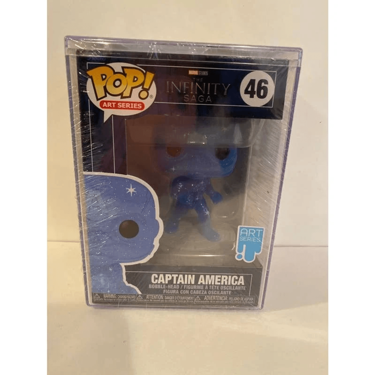 Una figura Funko Pop de Captain America Art Series en una caja protectora de plástico.