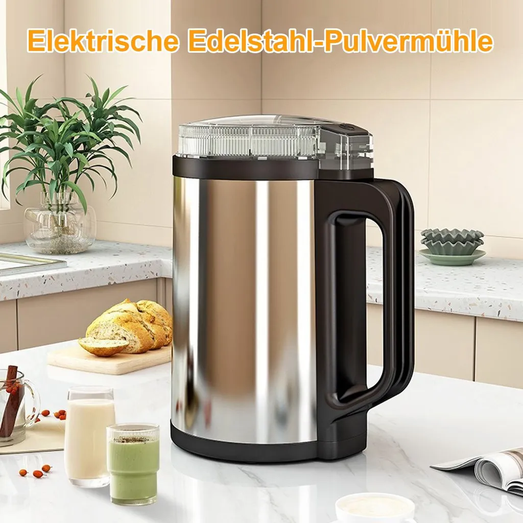 Edelstahl-Pulvermühle auf einem Küchentisch neben Brot und Getränken.