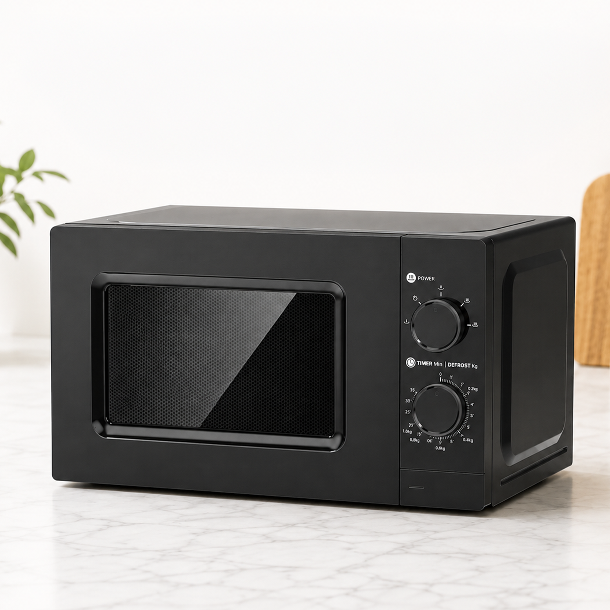 A modern black microwave with two rotary dials sits on a white marble countertop in a bright kitchen.