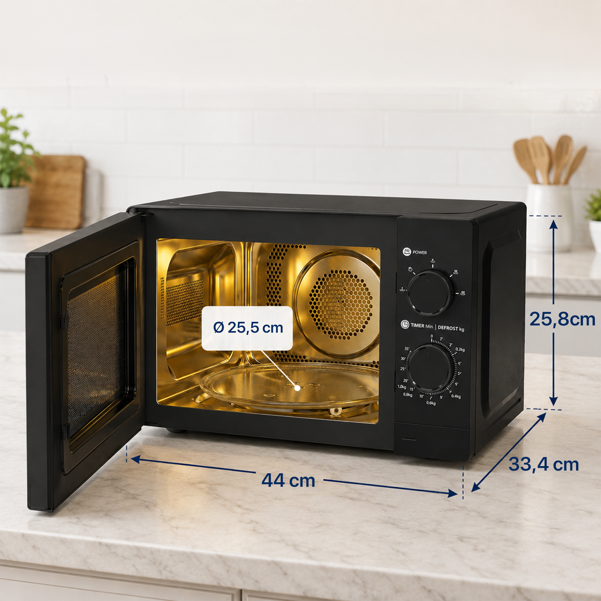 Black microwave with a gold interior and dimensions of 44x25.8x33.4 cm, shown on a white kitchen counter.
