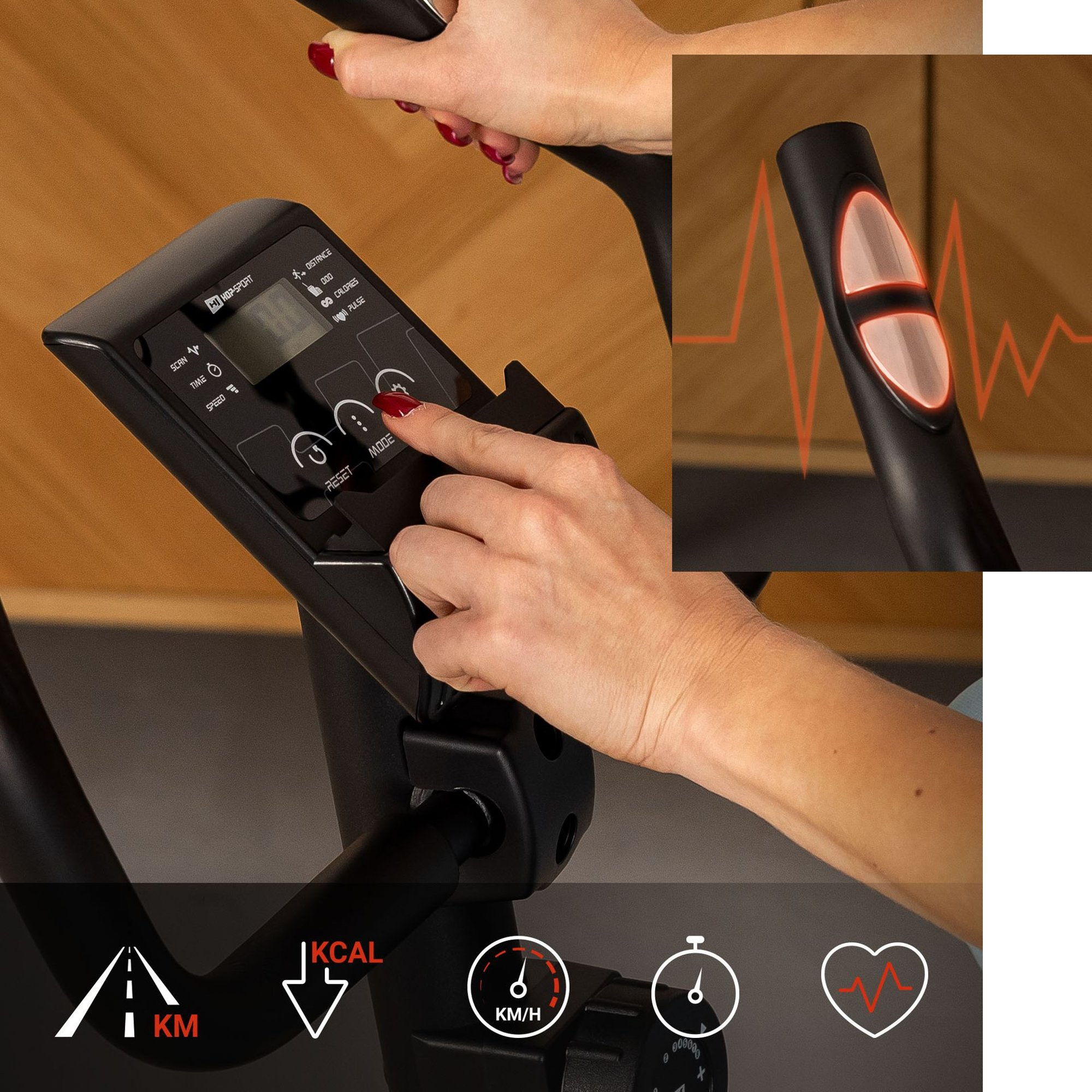 Eine Hand bedient den Computer eines Heimtrainers mit LCD-Bildschirm.