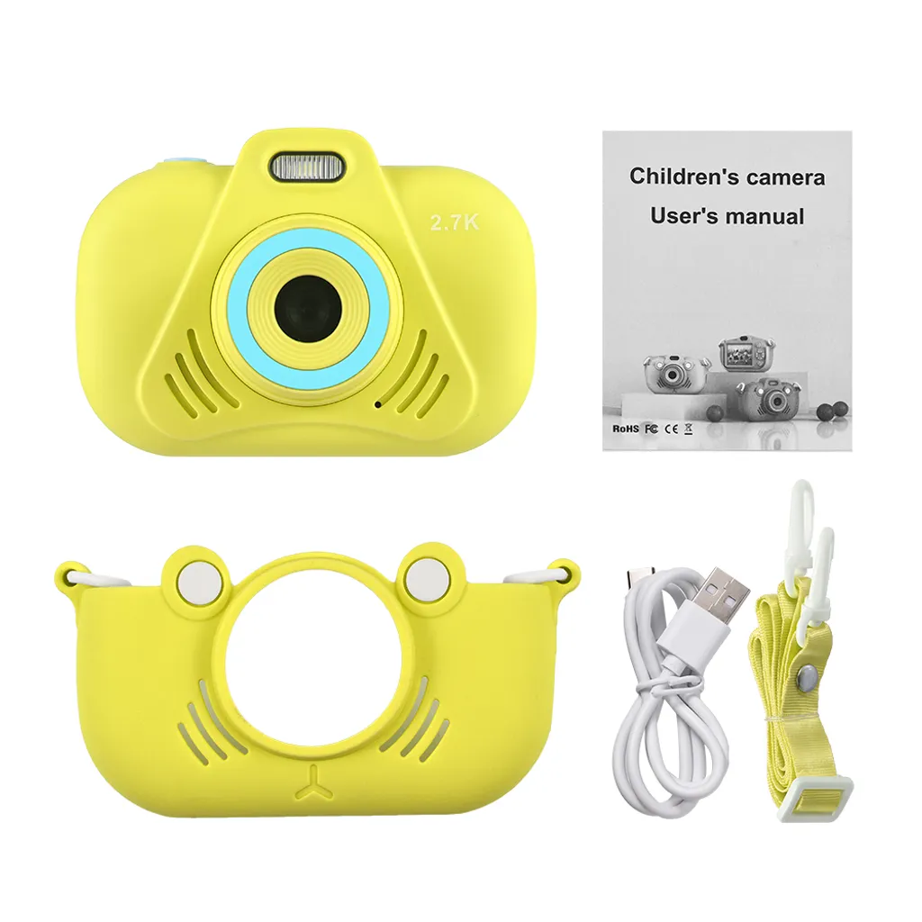 Gelbe Kinderkamera mit Schutzhülle, Bedienungsanleitung, USB-Kabel und Trageband.
