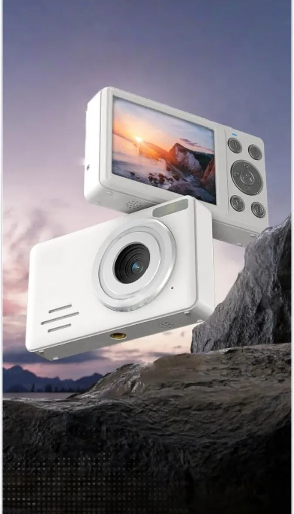 Zwei weiße Digitalkameras vor einer Felslandschaft und einem Sonnenuntergang.