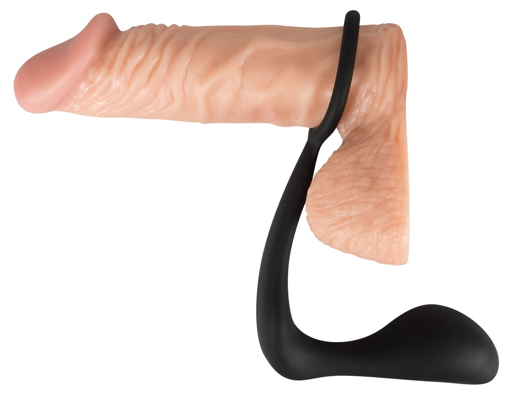 Ein hautfarbener Dildo mit angebrachtem schwarzen Haltebügel auf weißem Grund.
