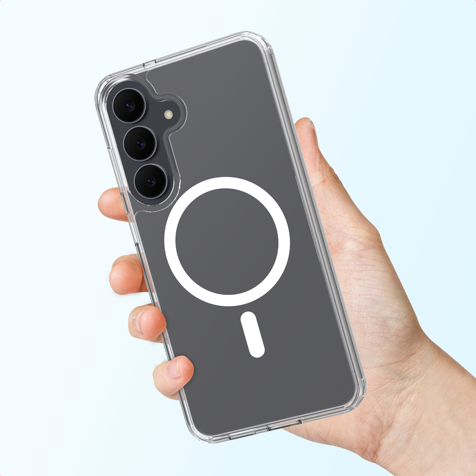 Une main tient un smartphone gris dans une coque transparente avec un anneau MagSafe blanc.