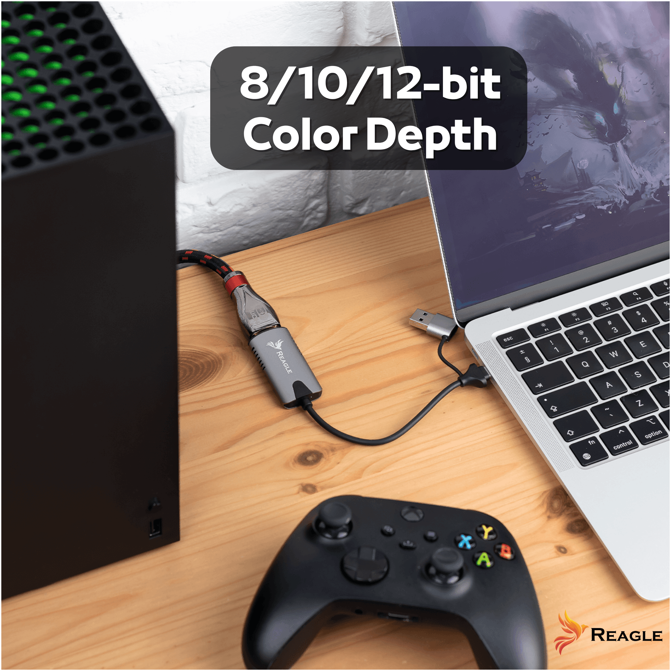 Un adattatore REAGLE collega una console a un laptop su una scrivania in legno con un controller.