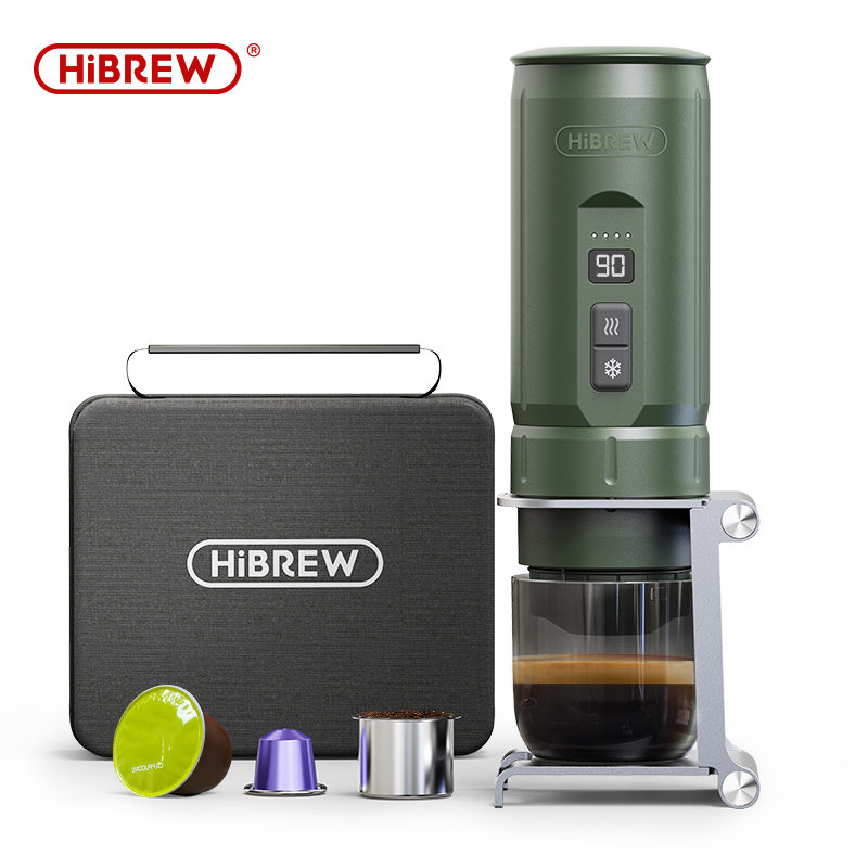 Cafetera portátil HiBrew verde con cápsulas, contenedor de café molido y estuche negro.