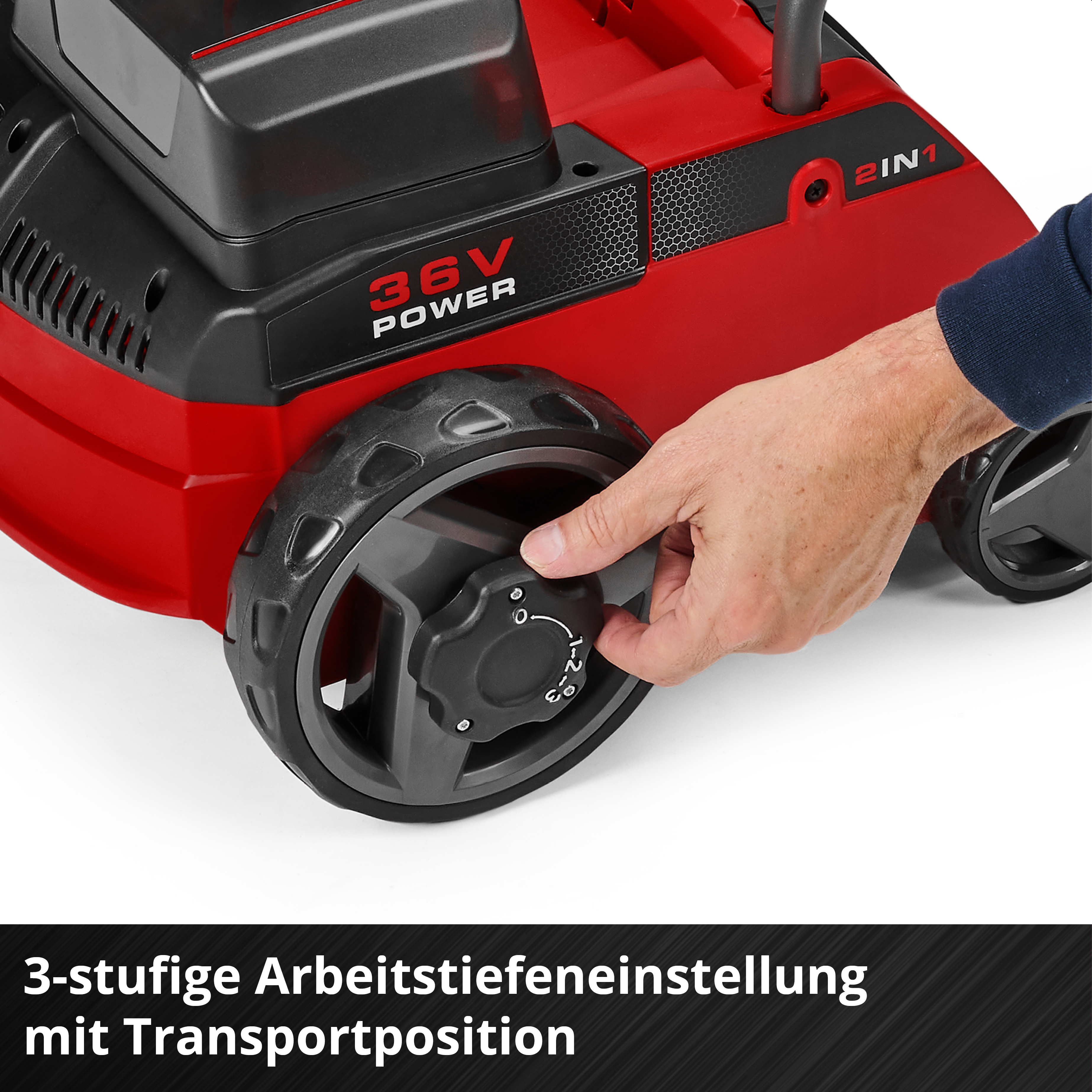 Eine Hand verstellt den Tiefenregler an einem rot-schwarzen 36V-Gartengerät.