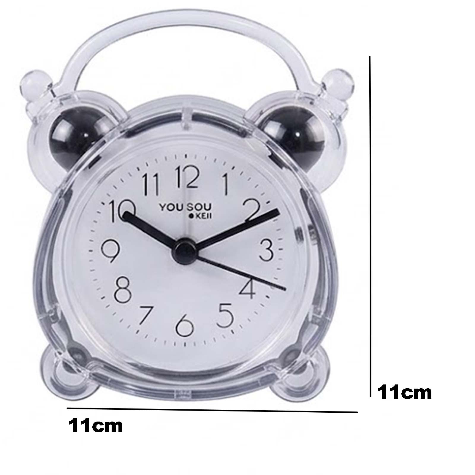 Pequeño reloj despertador transparente con esfera blanca y texto negro, de 11 cm.