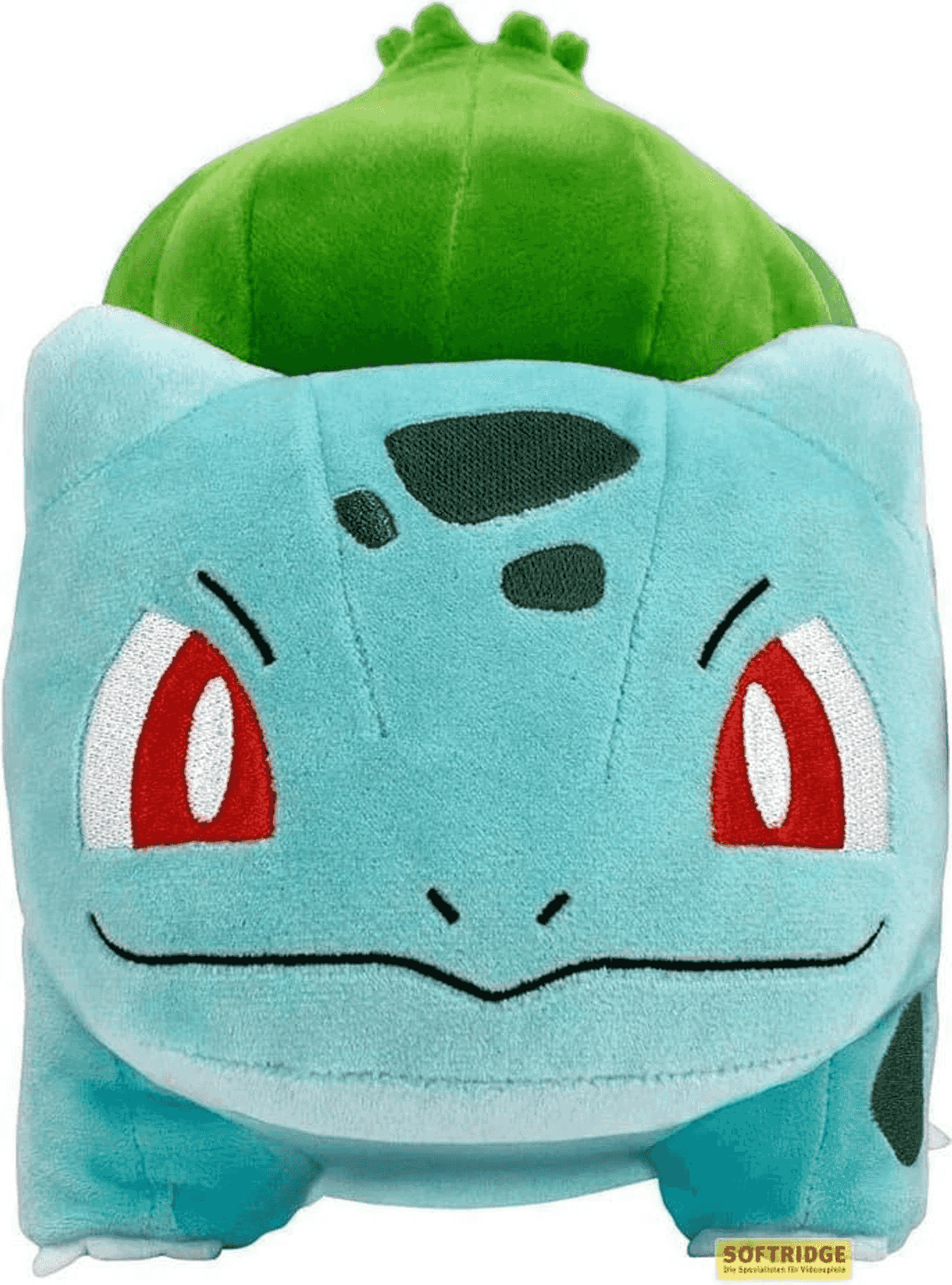 Ein Plüschtier des Pokémon Bisasam mit blaugrünem Körper, roten Augen und einer großen grünen Knospe auf dem Rücken.