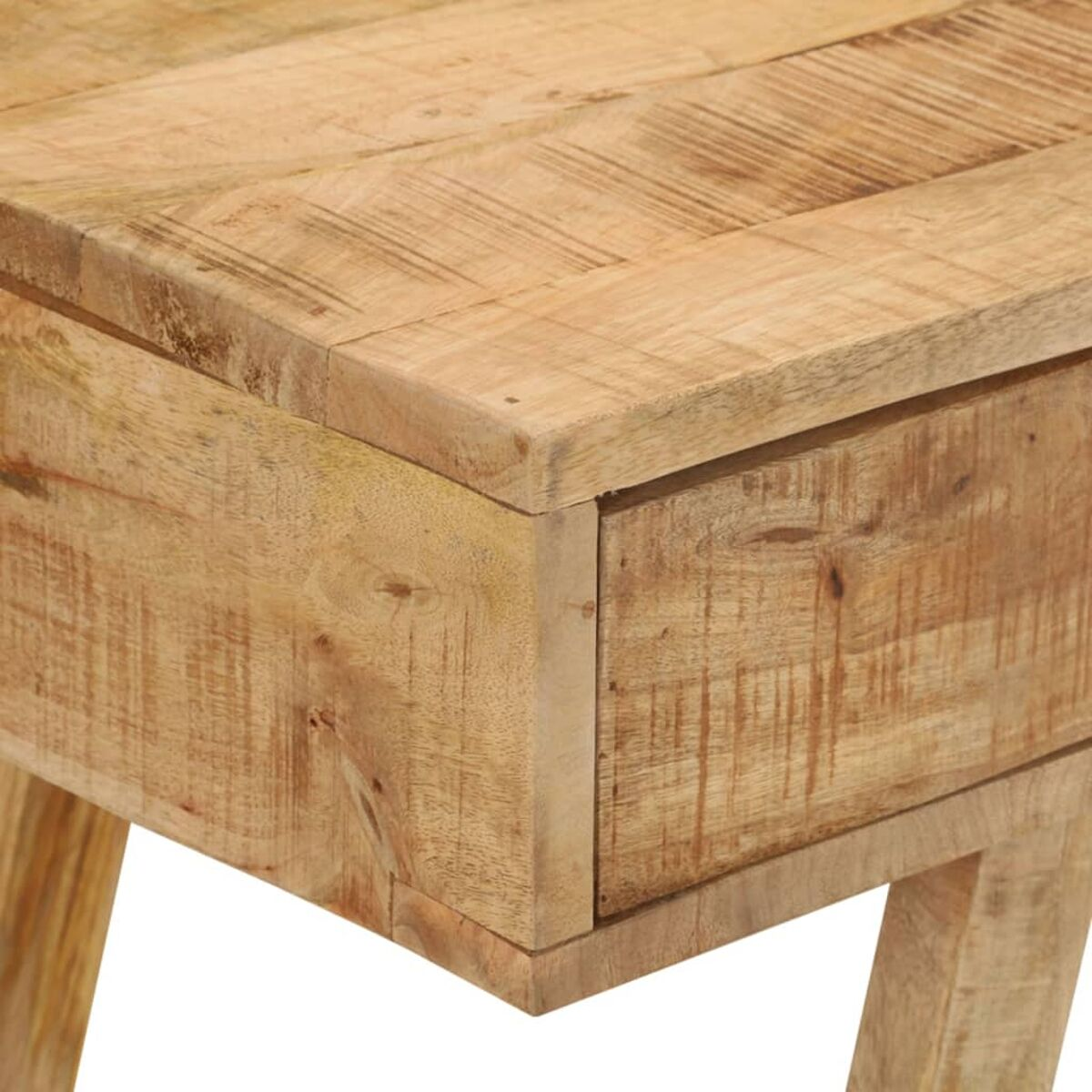 Nahaufnahme einer Holztischkante mit sichtbarer Maserung und einer Schublade.