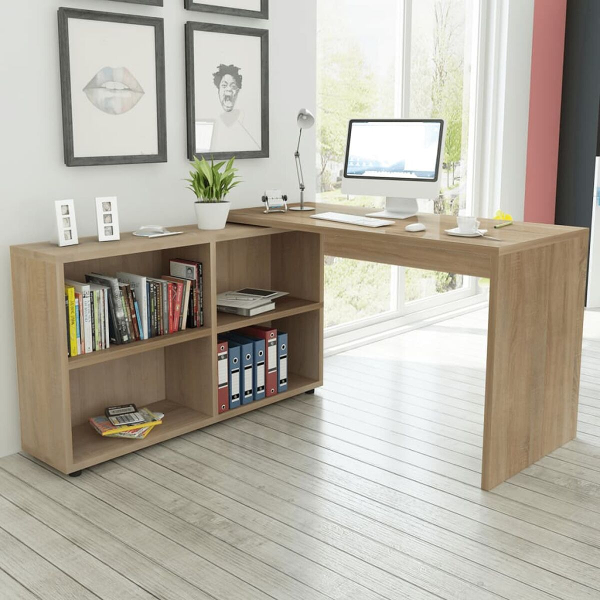 Moderno escritorio de madera con estantería integrada, ordenador, plantas y cuadros en una habitación luminosa.