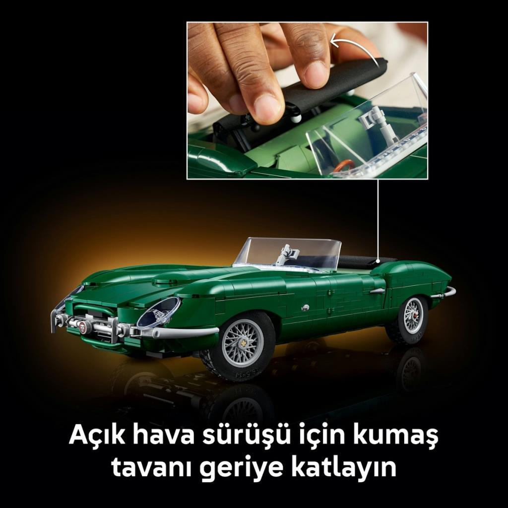 Un primer plano muestra manos plegando la capota de tela negra de un modelo de coche clásico de Lego sobre fondo oscuro.