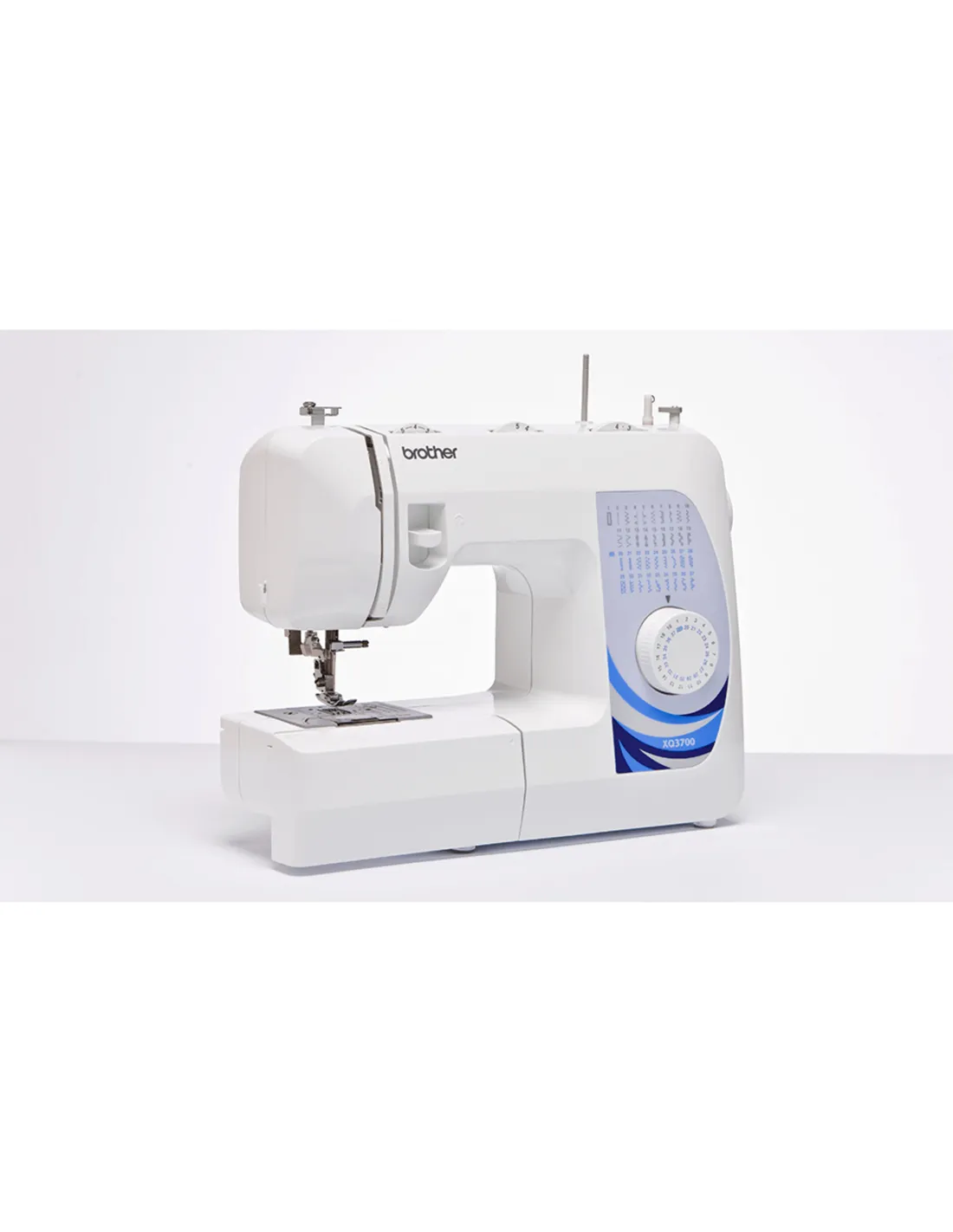 A white Brother sewing machine with blue accents and a stitch pattern panel on a white table.