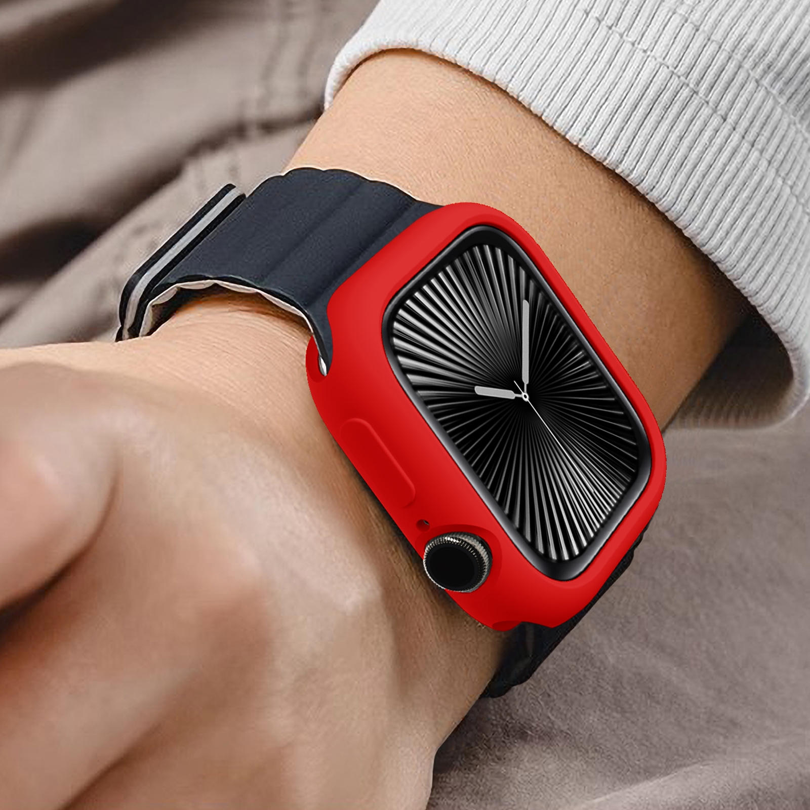 Eine Smartwatch mit einem leuchtend roten Gehäuseschutz und schwarzem Armband am Handgelenk.