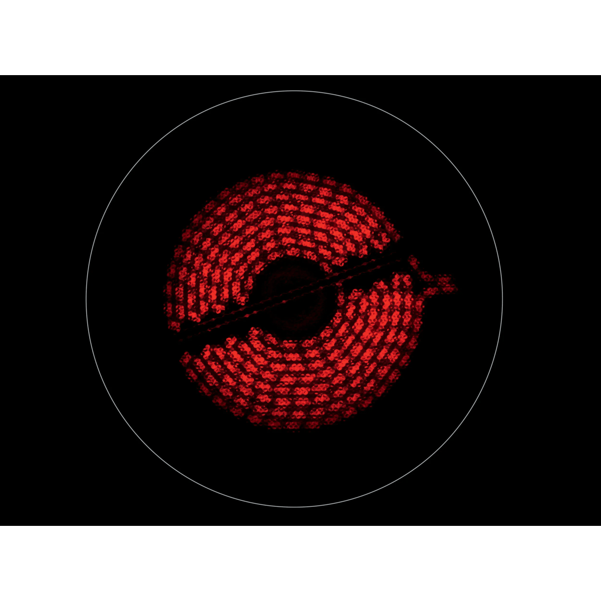 Una zona de cocción roja brillante en una placa vitrocerámica negra.